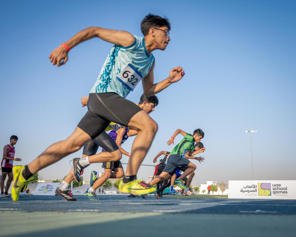 Athletes racing on the track at the UAE School Games