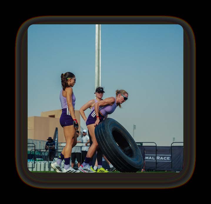 A women's team on the tyre flip at Primal Race