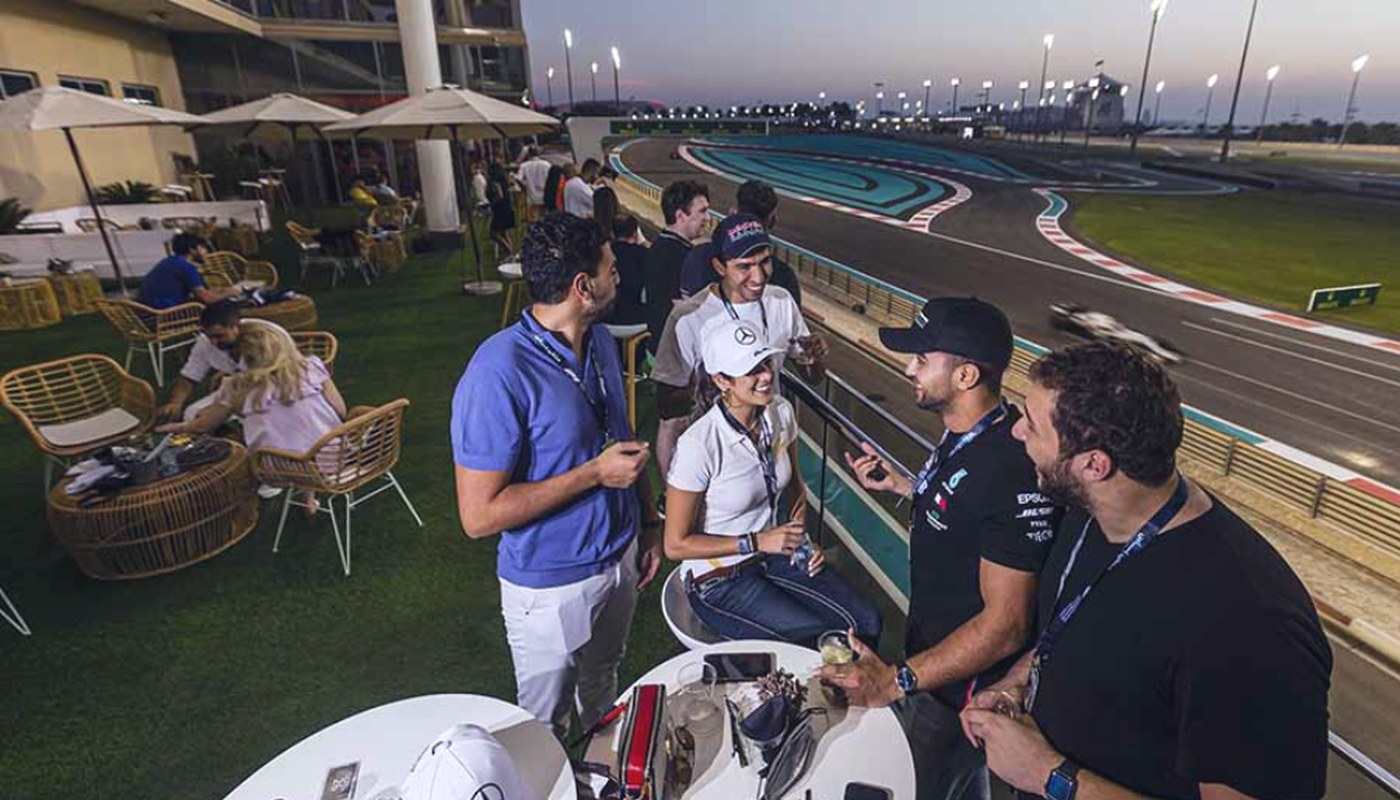 Guests on the Sunset Lounge terrace over Turn 5