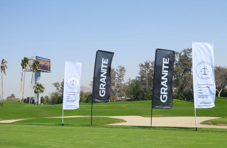 Sponsor flags beside the fairway at a WPSL event